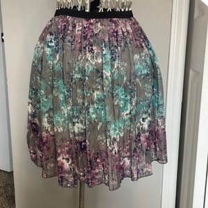 Small Mudd knee-length skirt. Grey with purple and blue floral.